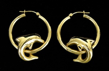 Appraisal: A Pair of Gold Hoop Earrings with Dolphins A pair