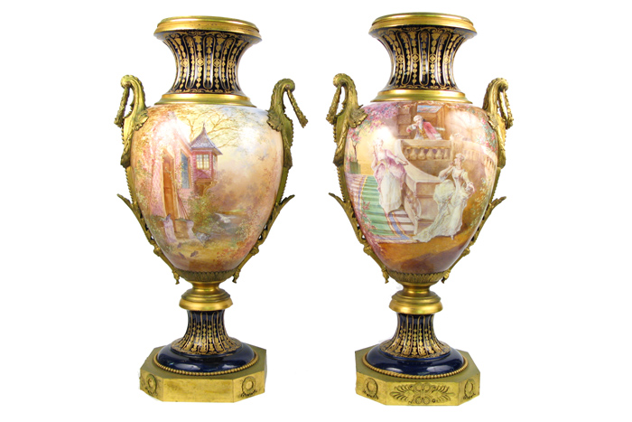 Appraisal: PAIR NINETEENTH CENTURY SEVRES PORCELAIN URNS gilt bronze mounted with