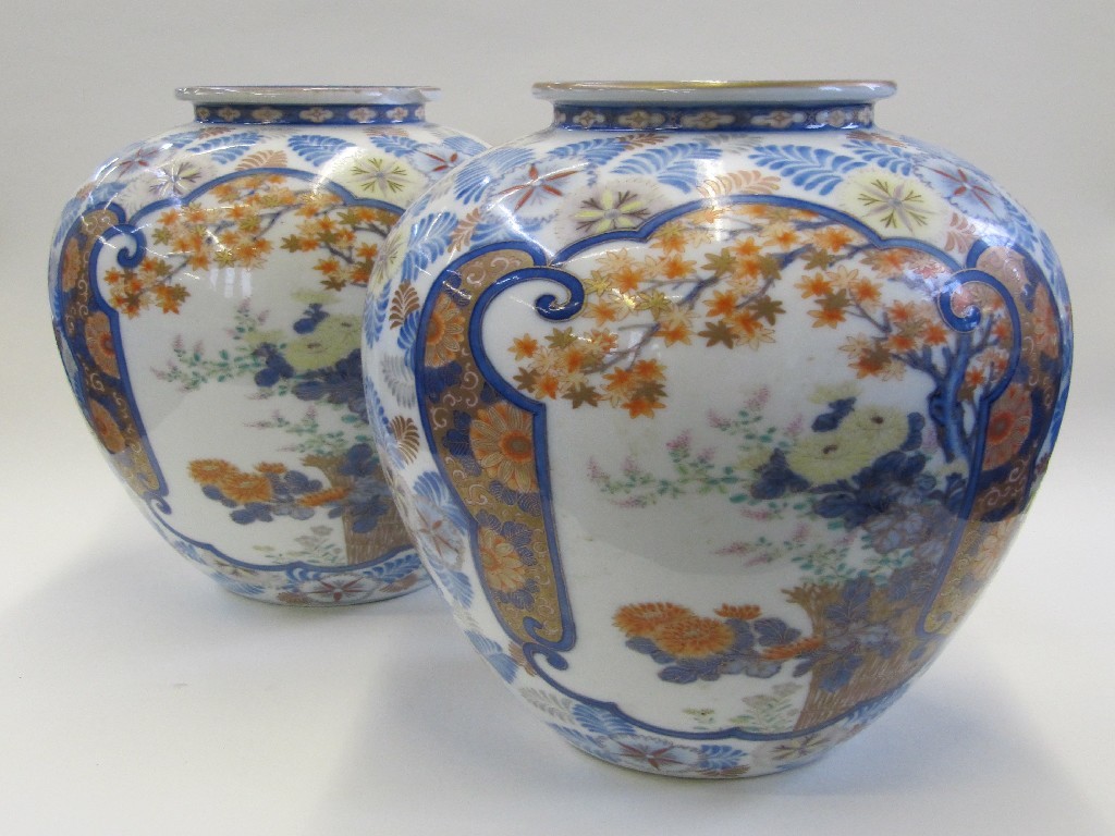 Appraisal: Pair of Japanese Arita vases decorated with flowers and foliage