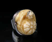 Appraisal: Carved Netsuke Ring seated mane with large basket carved netsuke