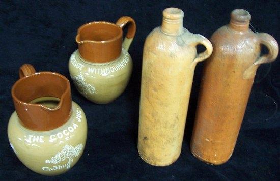 Appraisal: A stoneware cocoa jug advertising Cadbury's cm high a smaller