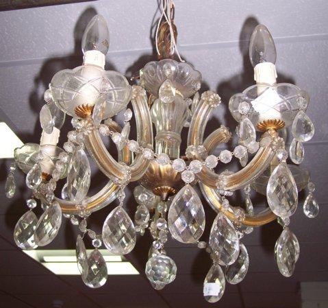 Appraisal: A pair of five-branch five-light electroliers hung frosted glass drops