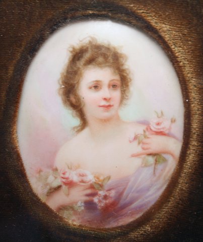 Appraisal: MINIATURE PAINTING OF A WOMAN WITH ROSES ON PORCELAIN Signed