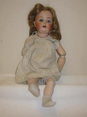 Appraisal: A Kestner bisque head girl doll with blue glass sleeping