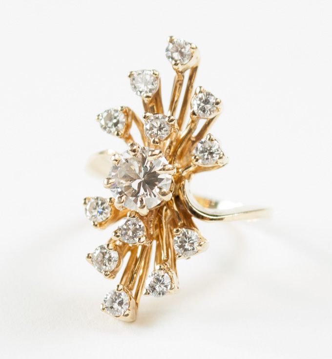 Appraisal: ESTATE DIAMOND AND FOURTEEN KARAT GOLD RING with twelve round