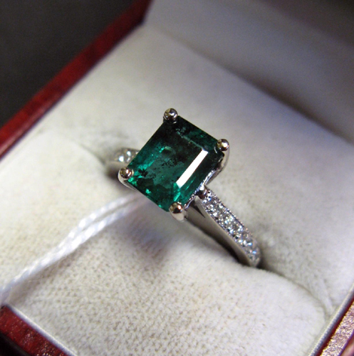 Appraisal: EMERALD DIAMOND AND FOURTEEN KARAT WHITE GOLD RING centering an