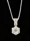 Appraisal: PENDANT - One K white gold cluster design pendant with