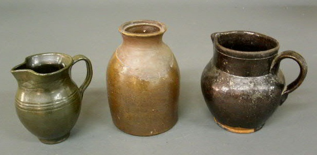 Appraisal: Three pieces of glazed earthenware - pitcher h x w