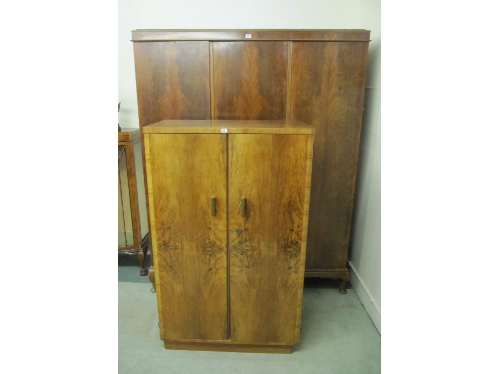 Appraisal: Walnut triple door wardrobe and a cupboard chest