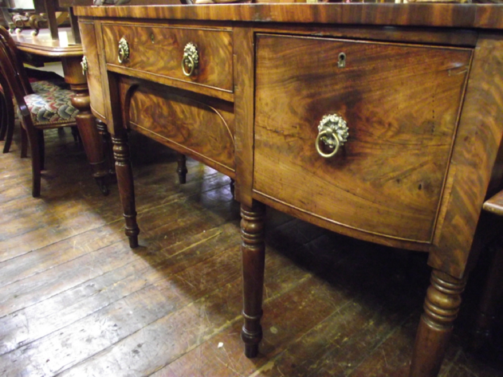 Appraisal: A Georgian mahogany D end sideboard the two central drawers