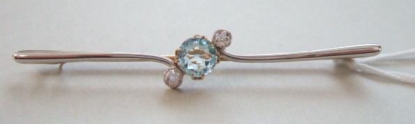 Appraisal: A gold aquamarine and diamond set three stone bar brooch