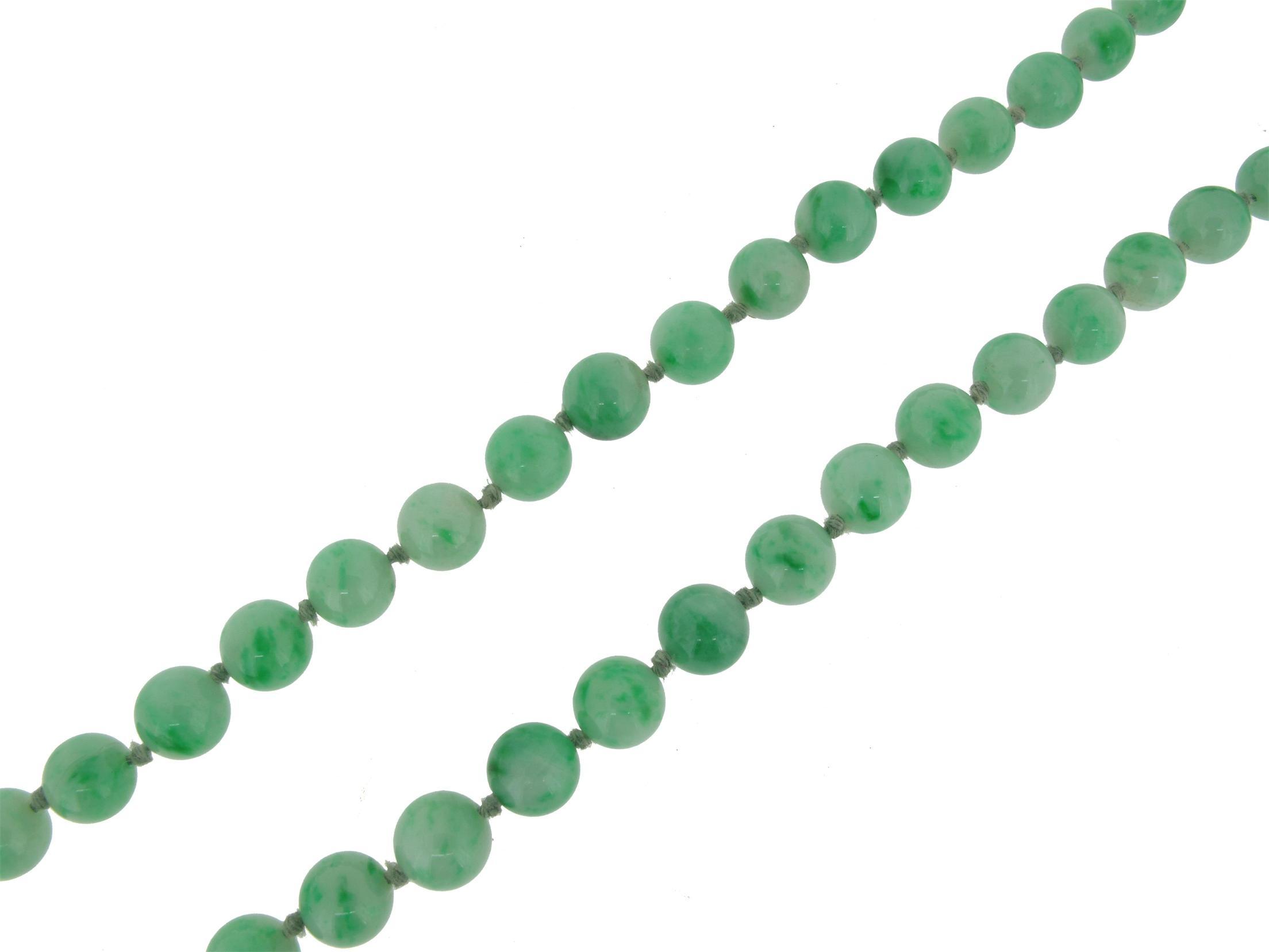 Appraisal: A matched single row jade bead necklace