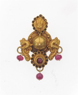 Appraisal: An Indian gold pendant Set with ruby cabochons g cm