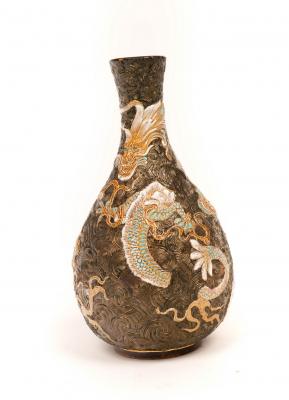 Appraisal: A Doulton dragon vase by Bessie Newbery the moulded dragons