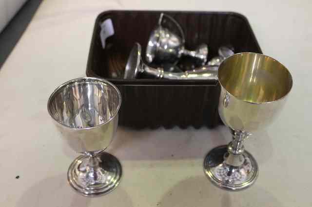 Appraisal: A PAIR OF MODERN SILVER GOBLETS with knopped stems and