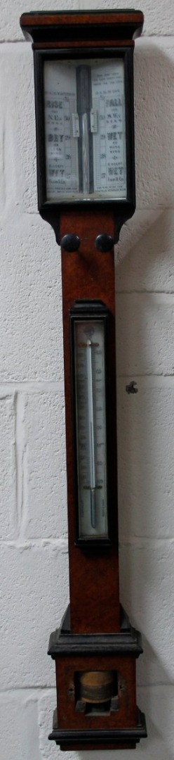 Appraisal: A late thC walnut and ebonised stick barometer the rectangular