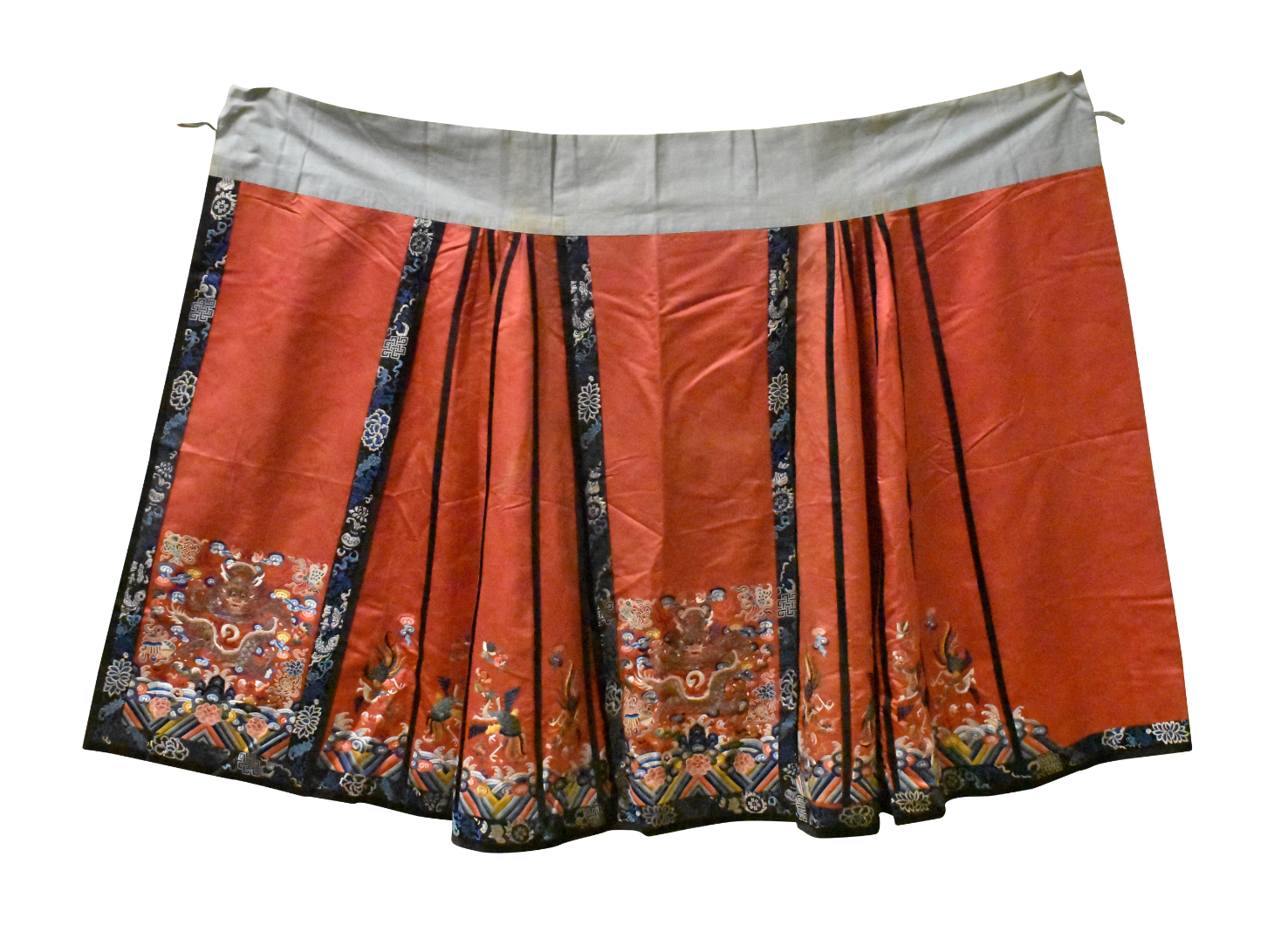 Appraisal: A Chinese red embroidery skirt A salmon colored skirt with