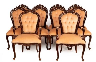 Appraisal: A set of ten dining chairs with scrolling crest rails