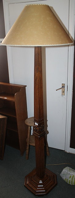 Appraisal: AN OAK STANDARD LAMP with fluted decoration standing on a