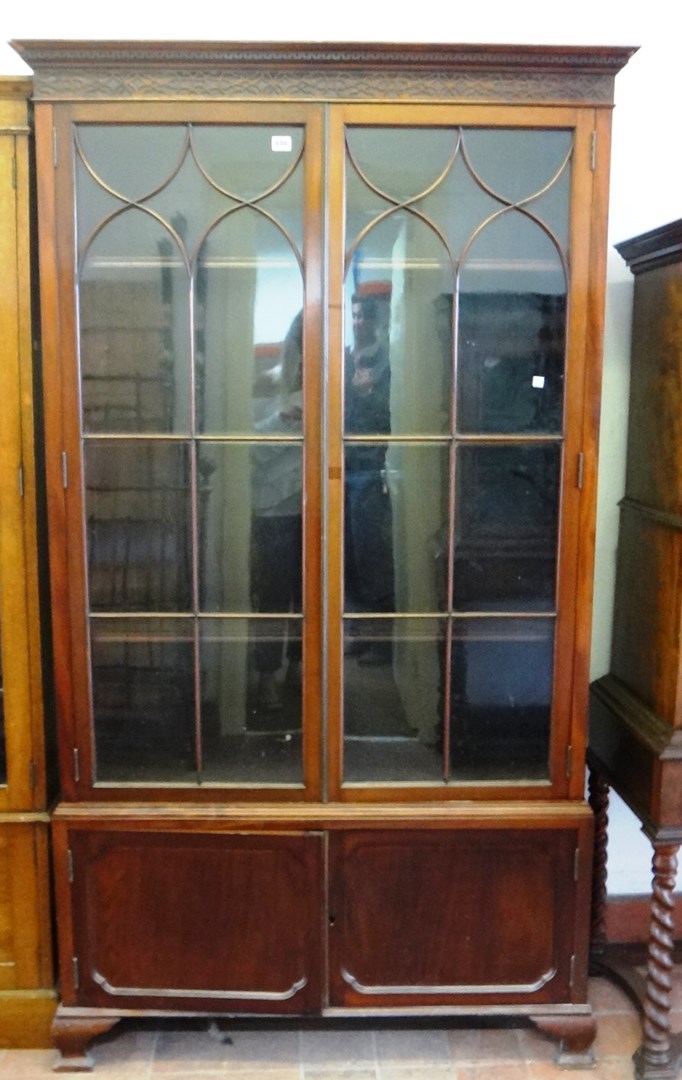 Appraisal: A late th century mahogany bookcase the blind fret cornice