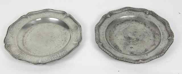 Appraisal: Two wavy edged pewter plates th Century with gadrooned rims