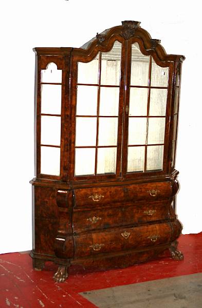 Appraisal: A Dutch Rococo style walnut vitrine cabinet last quarter th