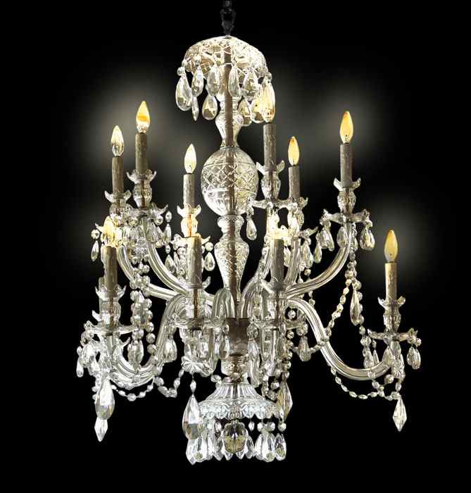 Appraisal: MONUMENTAL LIGHT GLASS CHANDELIER Dripping in crystal prisms and chains