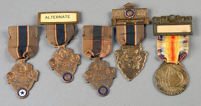 Appraisal: American Legion national convention badges from worn ribbons