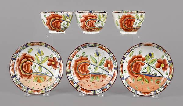 Appraisal: Three Gaudy Dutch oyster pattern cups and saucers th c