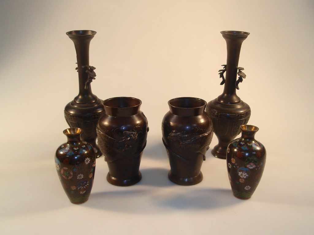 Appraisal: A pair of early thC Japanese bronze baluster vase cat