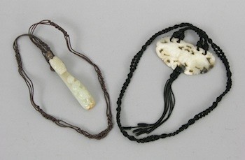 Appraisal: Two Carved Jade Ornaments on Macrame Chords First ornament is