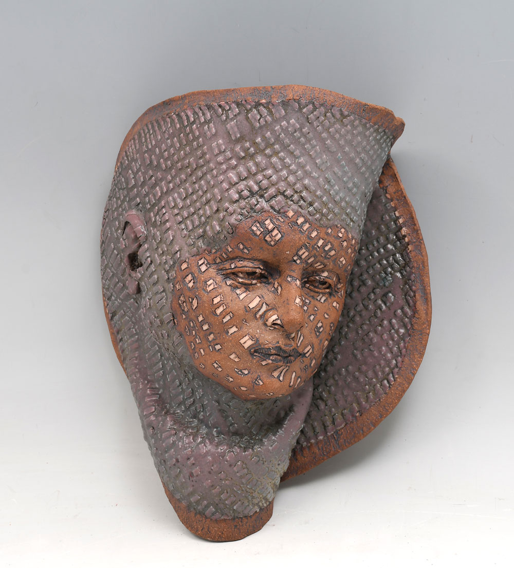 Appraisal: INLAID STONEWARE MASK OF WOMAN BY JOY BARNES Abstract Female