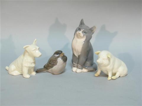 Appraisal: MENAGERIE OF FOUR PORCELAIN ANIMALS Including a Belleek white-glazed seated