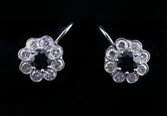 Appraisal: PAIR PLATINUM SAPPHIRE AND DIAMOND EARRINGS Floral motif mounting centered