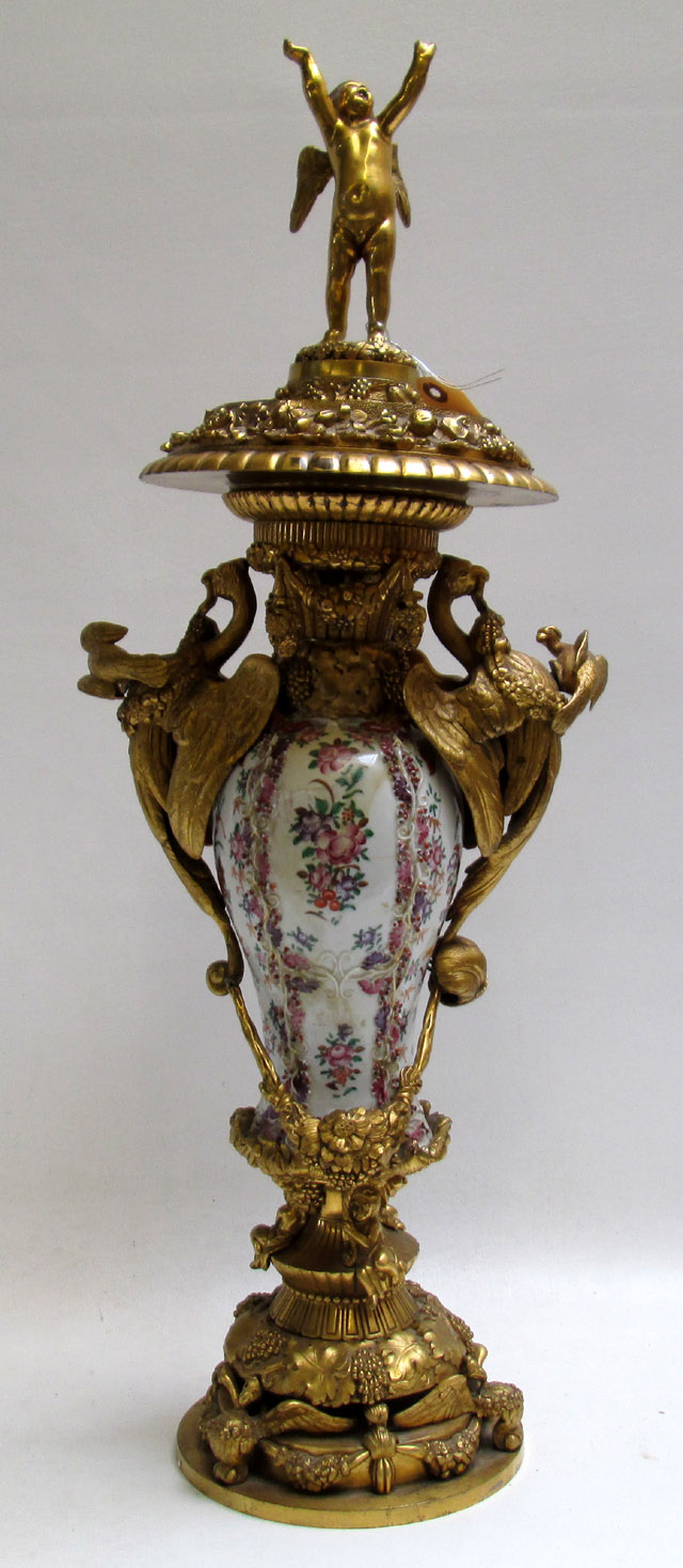 Appraisal: FRENCH GILT BRONZE AND PORCELAIN URN with cherub finial and