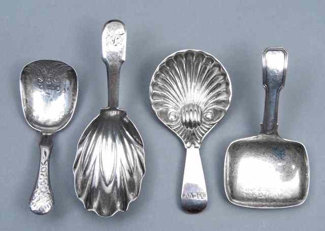 Appraisal: A GEORGE III SILVER CADDY SPOON with a pressed leaf