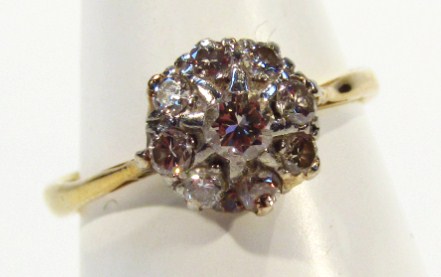 Appraisal: A ladies dress ring florally set with small diamonds on