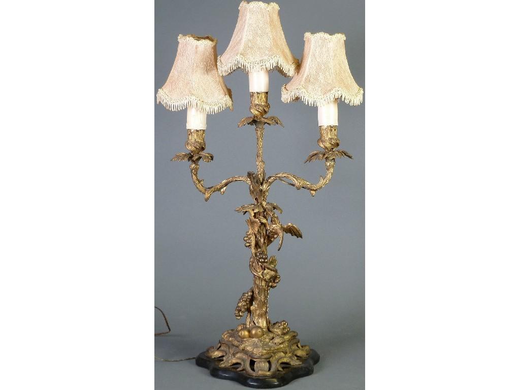 Appraisal: LATE NINETEENTH CENTURY GILT METAL THREE LIGHT CANDELABRA modelled as