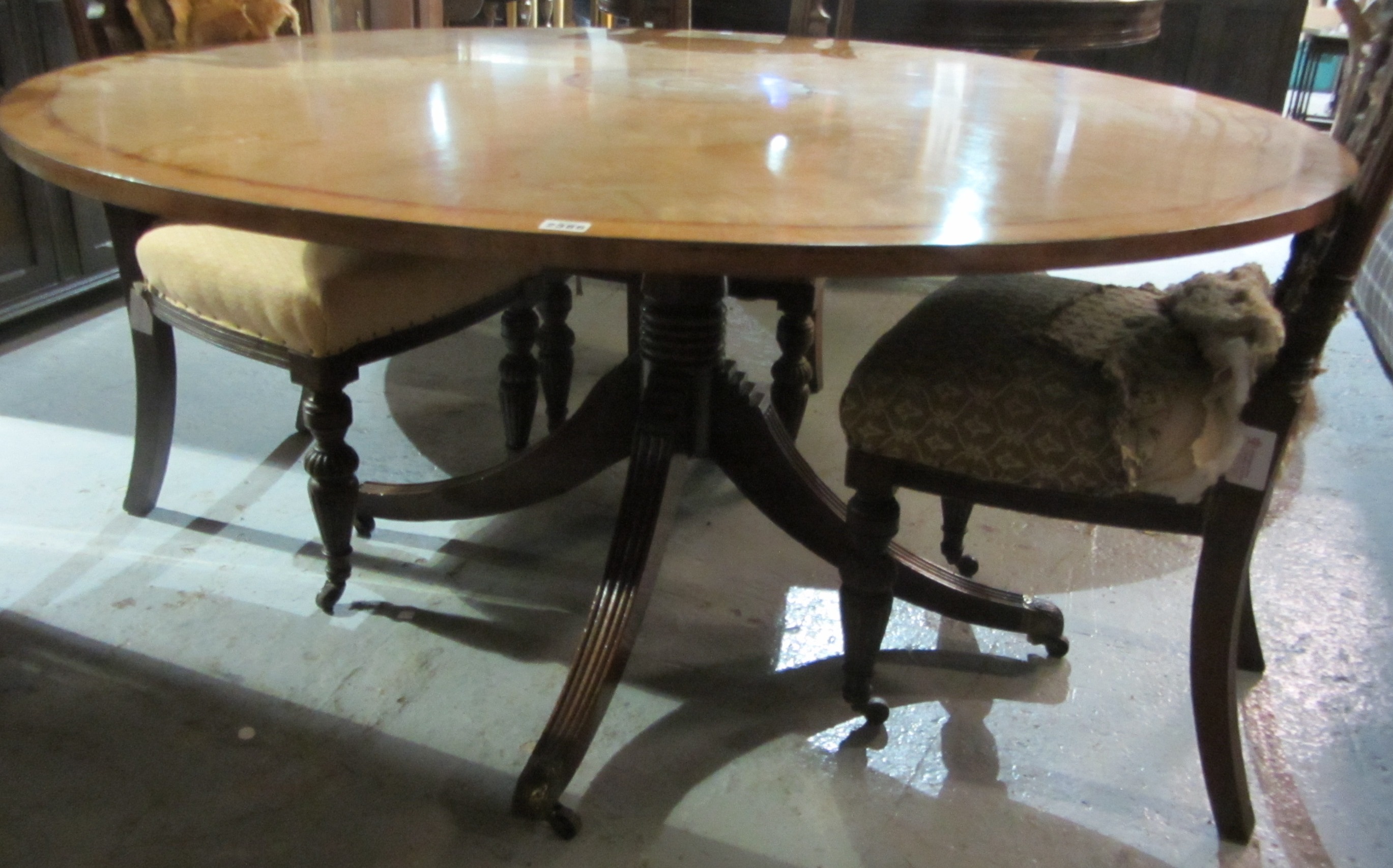 Appraisal: A large mahogany and inlaid circular dining table