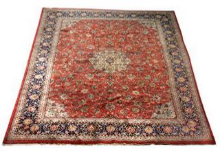 Appraisal: Hand knotted Sino-Isfahan wool rug having a small lobed medallion