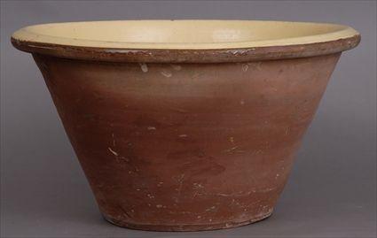 Appraisal: LARGE TERRACOTTA JARDINI RE The interior with yellow glaze in