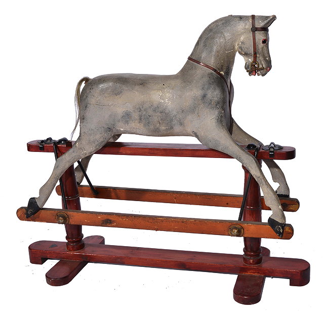 Appraisal: AN OLD GREY PAINTED TRI-ANG ROCKING HORSE on a pine