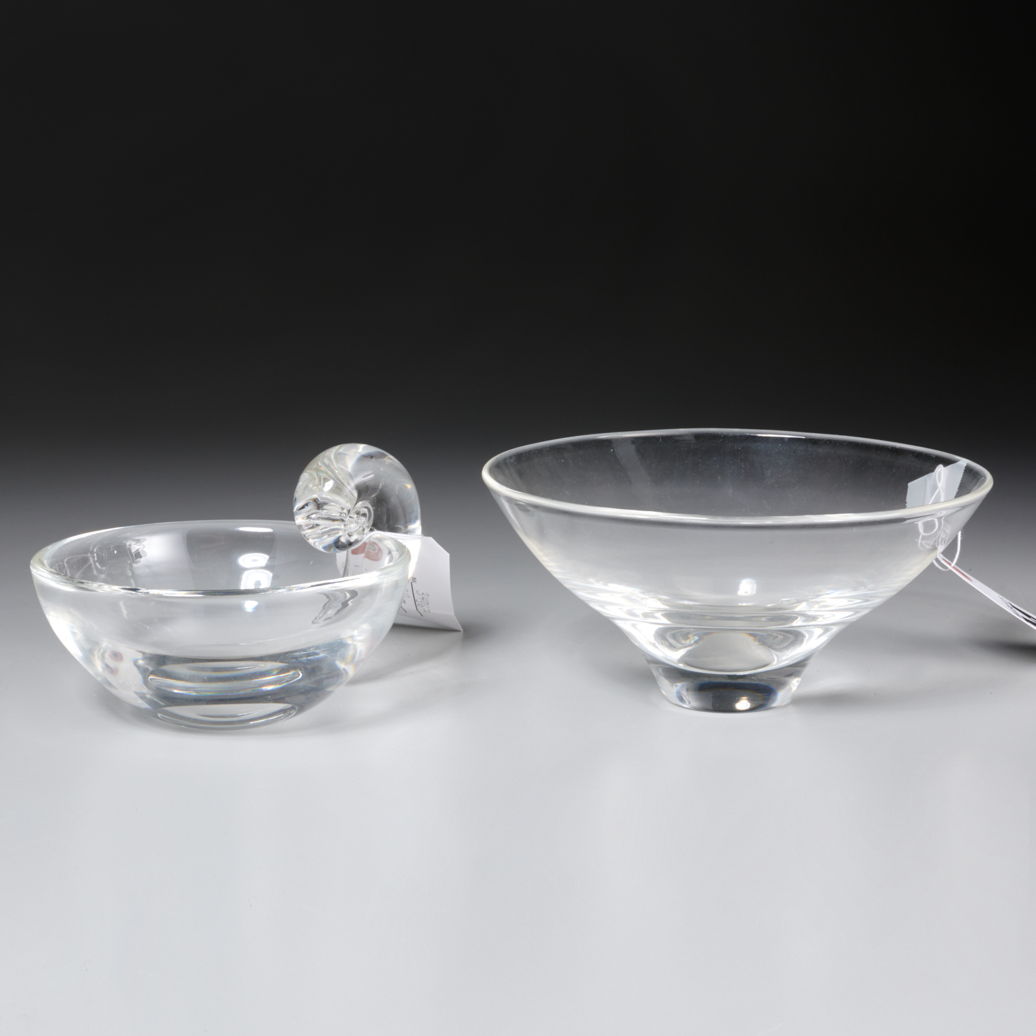 Appraisal: STEUBEN COLORLESS GLASS BOWLS th c American incl a footed