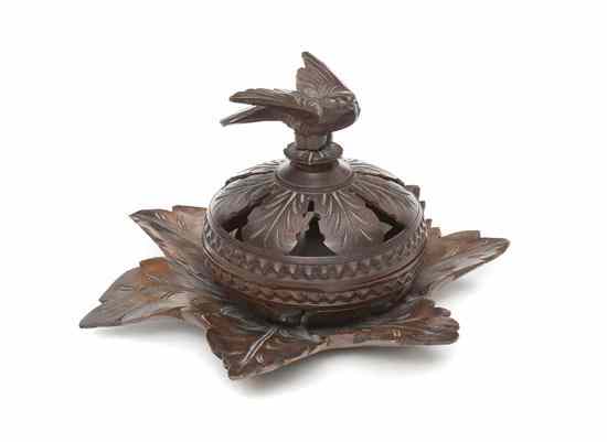 Appraisal: A Carved Walnut Box having a bird form finial over