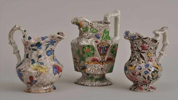 Appraisal: THREE STAFFORDSHIRE TRANSFER-PRINTED MILK JUGS Each baluster or octagonal body