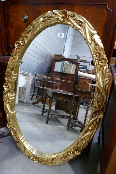 Appraisal: Large oval gold beveled mirror with floral design