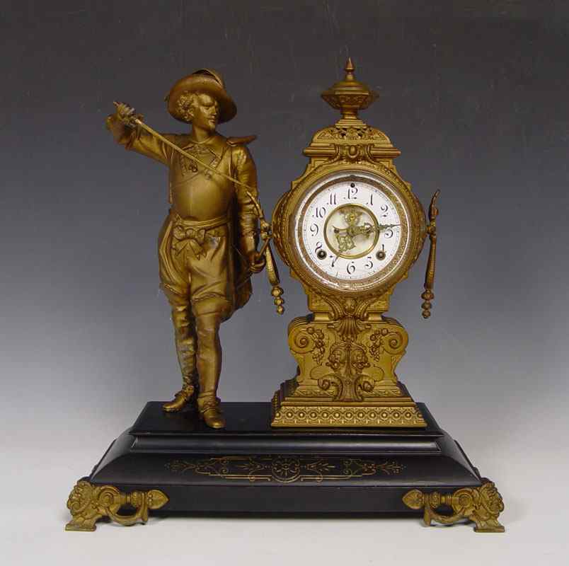 Appraisal: ANSONIA FIGURAL CAVALIER CLOCK Bronzed metal cavalier drawing sword and