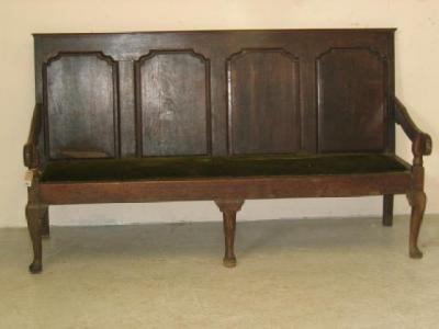 Appraisal: A GEORGE III OAK SETTLE th century the back with