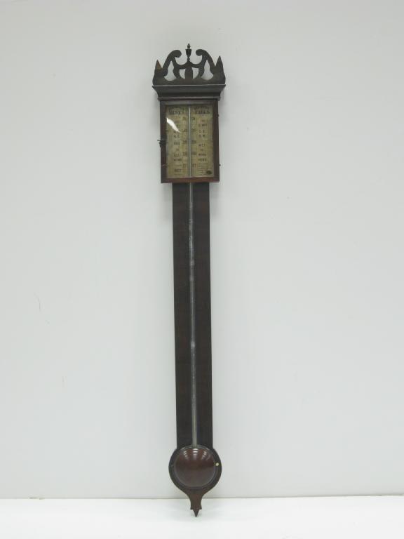 Appraisal: A Georgian Stick Barometer with pierced surmount and urn finial