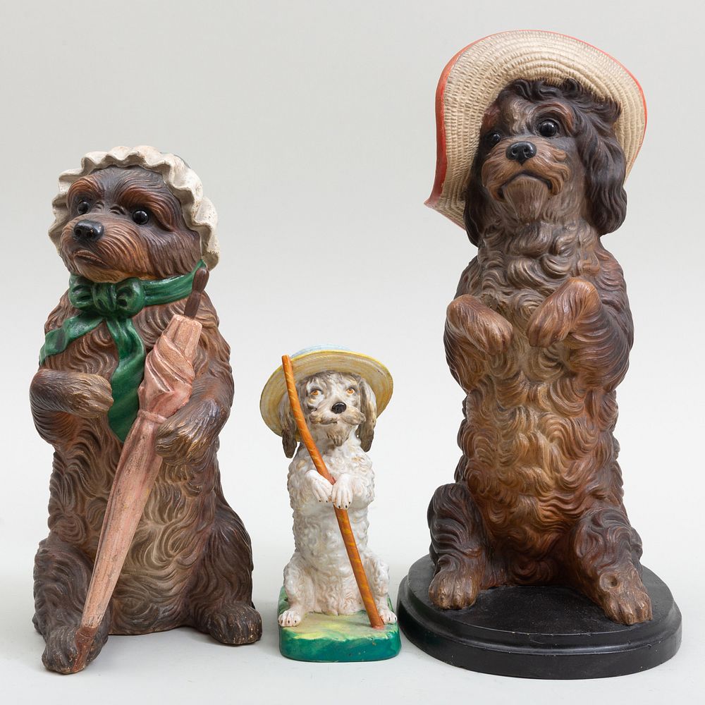 Appraisal: Three Painted Ceramic Dogs Wearing Fashionable Hats The smallest a